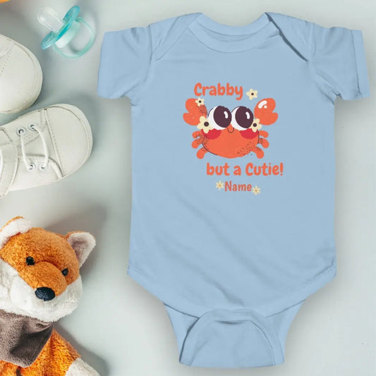 Light Blue short sleeved body suit with cartoon crab that says crabby but a cutie personalized.