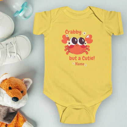 Butter Yellow short sleeved body suit with cartoon crab that says crabby but a cutie personalized.