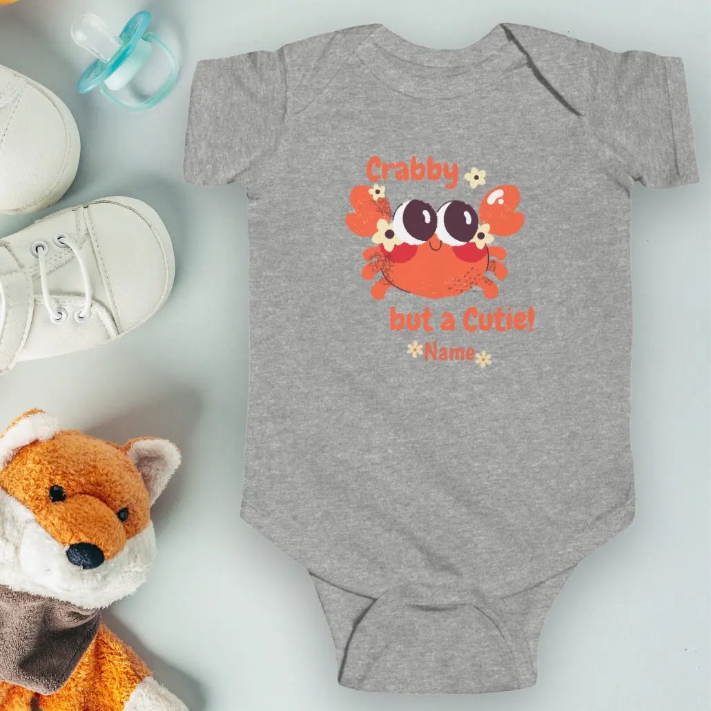 Heather Gray short sleeved body suit with cartoon crab that says crabby but a cutie personalized.