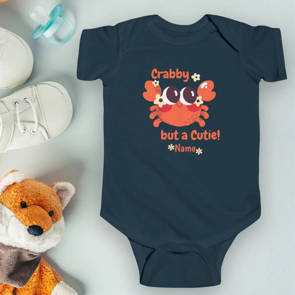 Navy short sleeved body suit with cartoon crab that says crabby but a cutie personalized.