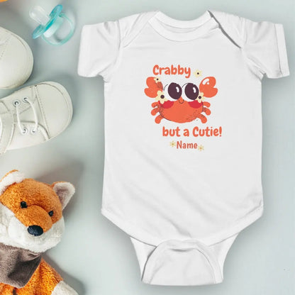 White short sleeved body suit with cartoon crab that says crabby but a cutie personalized.