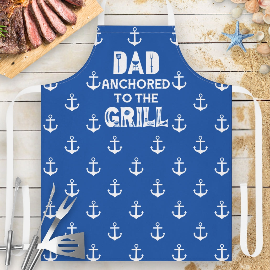 Blue apron with anchor patterns and text 'DAD Anchored to the GRILL.