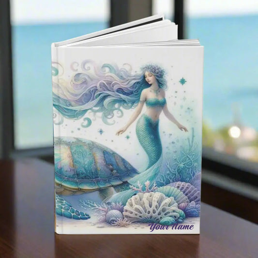 Hardcover Journal with mermaid and sea turtle underwater with sea shells and plant life in purple and aqua colors