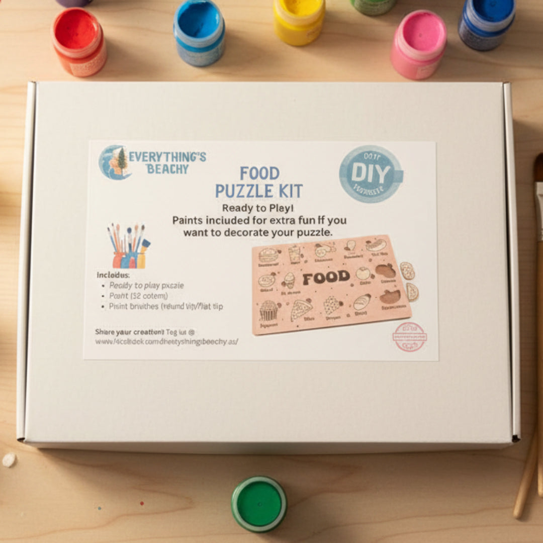A closed white box labeled “Food Puzzle Kit”.