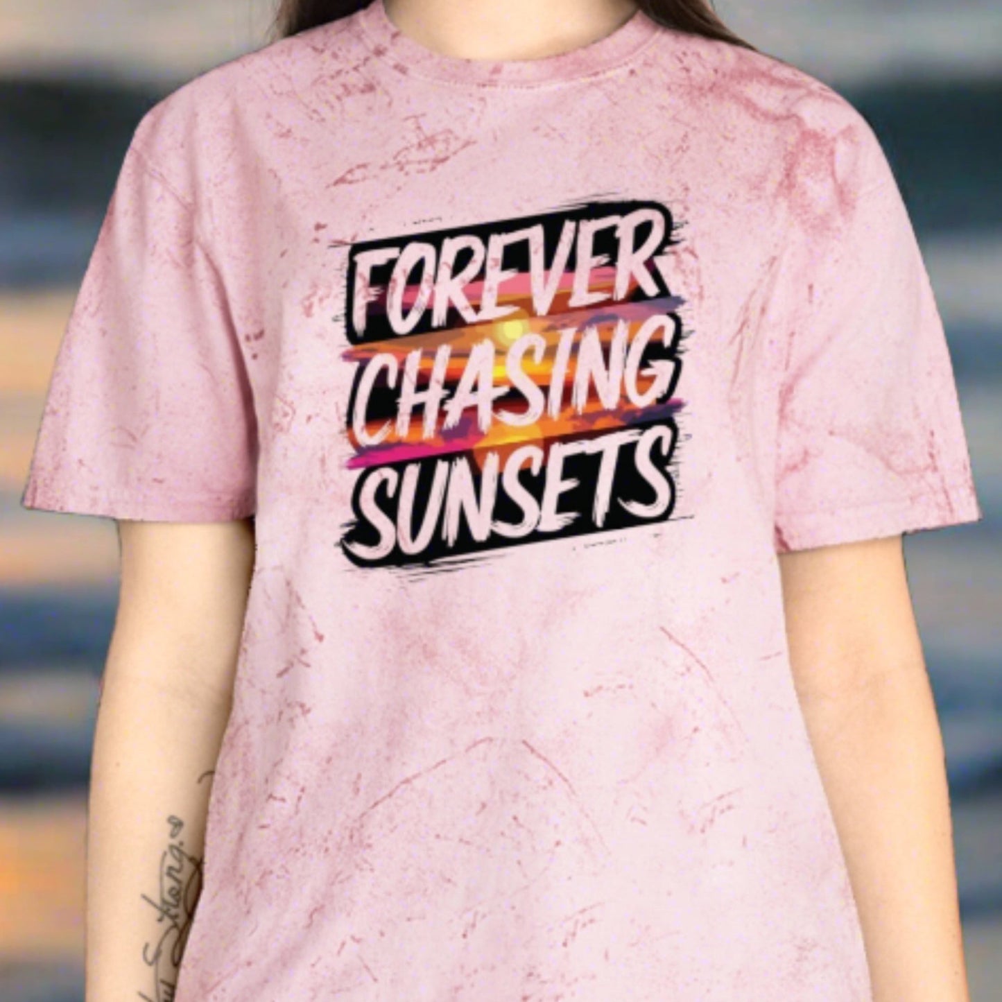 a clay color burst t-shirt that has a sunset on it with the words chasing sunsets on it.