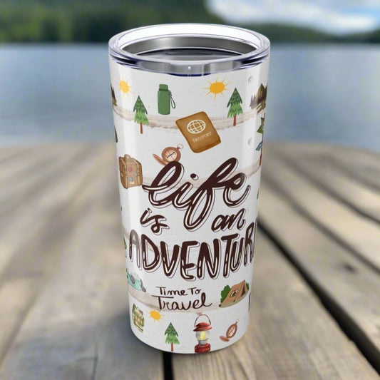 20oz stainless steel tumbler with “Life is an Adventure” text and wraparound print featuring tents, compass, trees, sun, lantern, and camping icons.