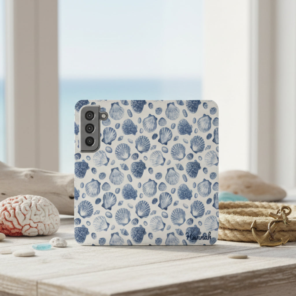 Personalized flip phone case with hand-drawn blue seashell pattern on faux leather