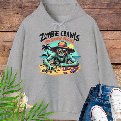 Gray hoodie with a zombie graphic and 'Zombie Crawls and Sandy Shores' text on a wooden background.
