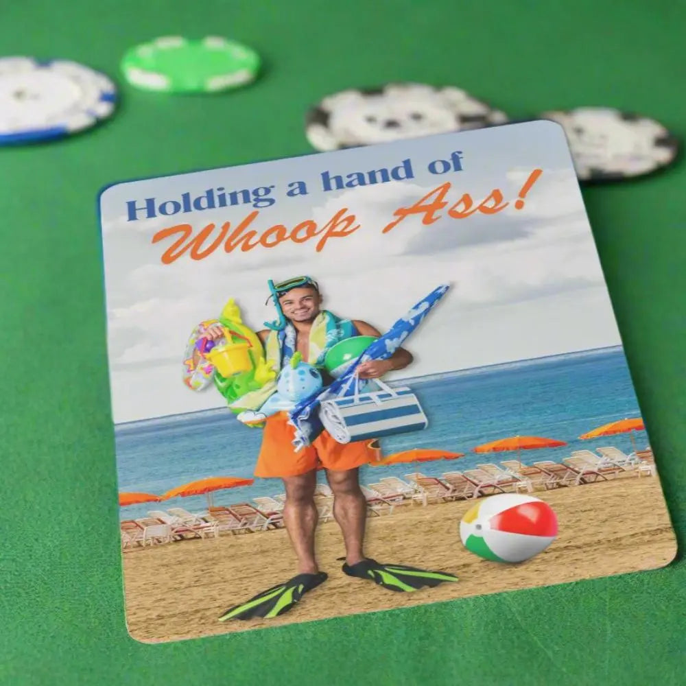 Playing cards with the image of a man holding a bunch or beach gear with swimming fins on this feet at the beach with the text Holding a hand of whoop ass.