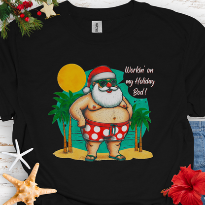 Black T-shirt with Santa with swim shorts on the beach with text Workin' on my Holiday Bod'!