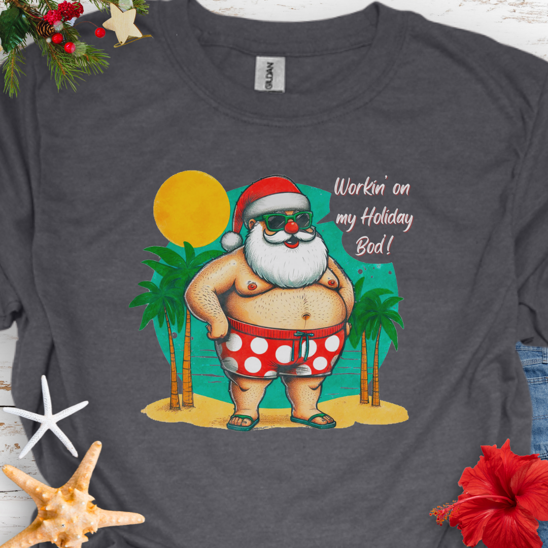 Dark Heather T-shirt with Santa with swim shorts on the beach with text Workin' on my Holiday Bod'!