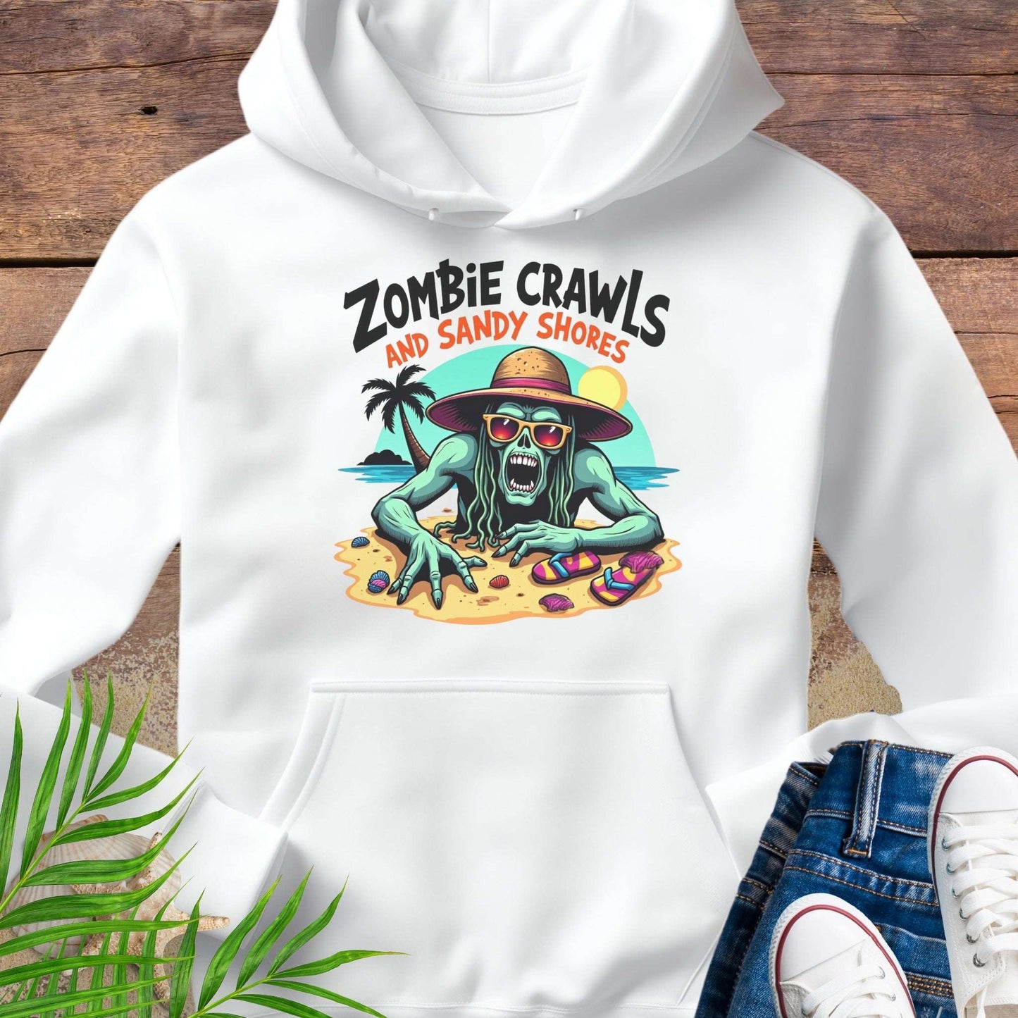 White hoodie with a zombie graphic and text on a wooden surface