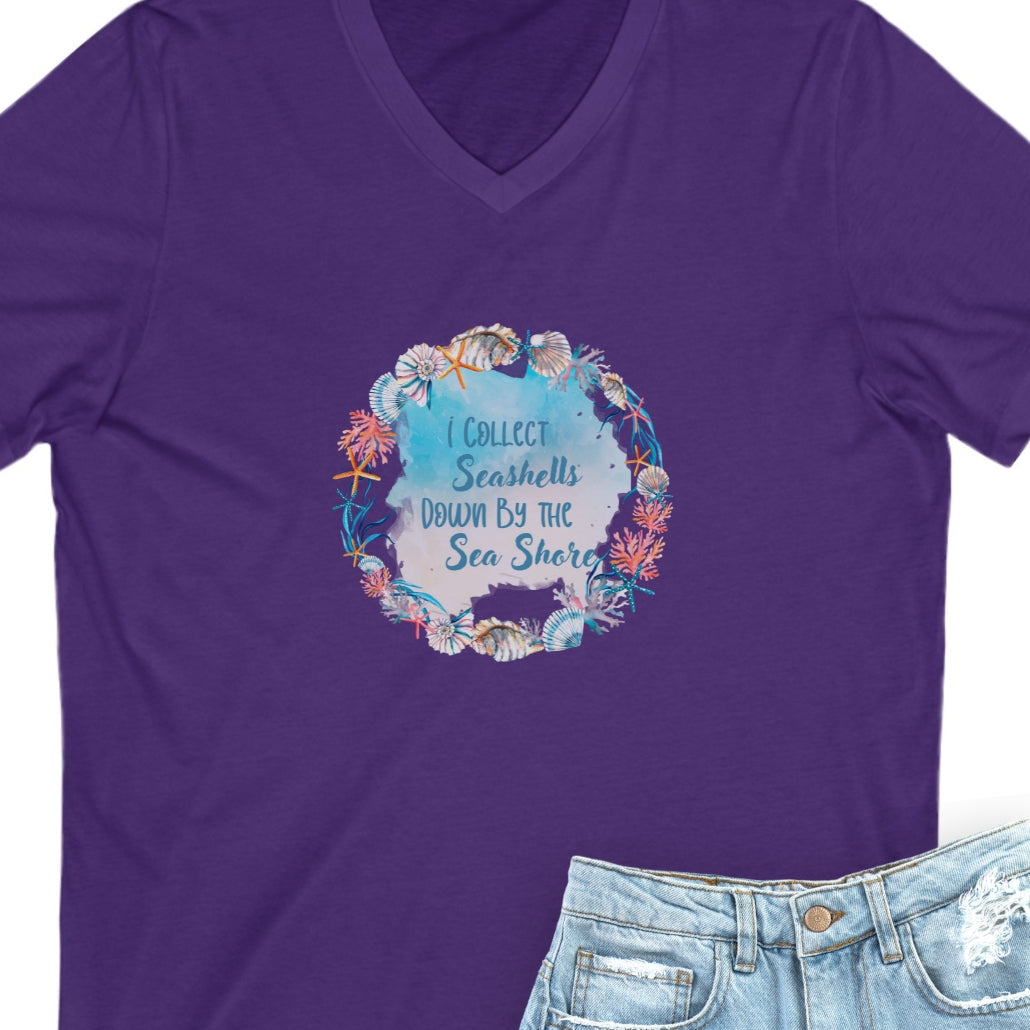 Purple t-shirt with seashell wreath with text I collect Sea shells by the Seashore