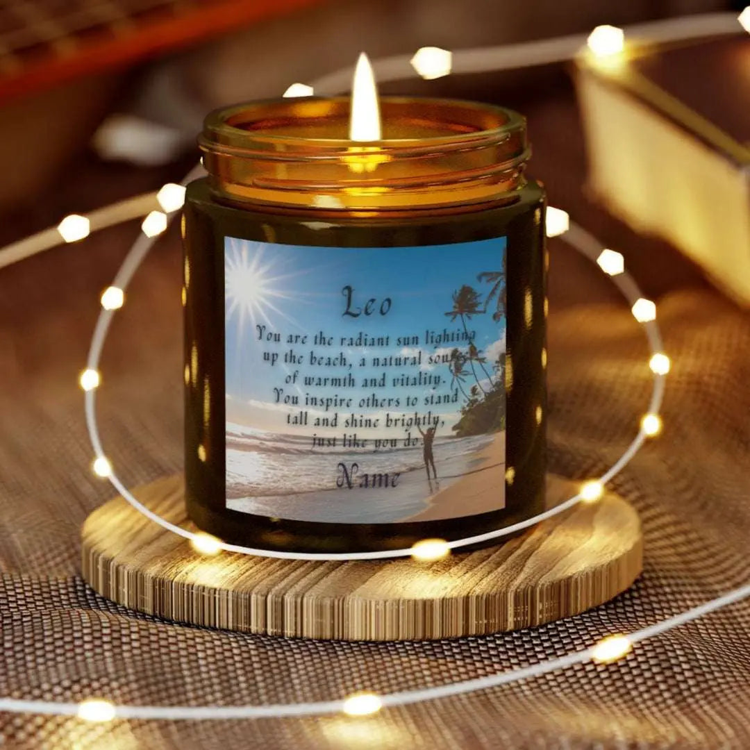 Elegant Leo Zodiac hand-poured coconut apricot wax scented candle in a 4 oz amber glass jar, featuring a picture of the ocean and beach with palm trees and woman raising her hands to the sun with an inspirational quote personalized. A beach-inspired astrology gift, perfect for relaxation and decor.