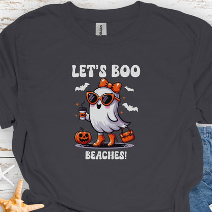 Charcoal  t-shirt with a girl ghost wearing sunglasses, high heels and an orange bow in hair holding a purse and coffee with bats flying around with text Let's Boo Beaches' 