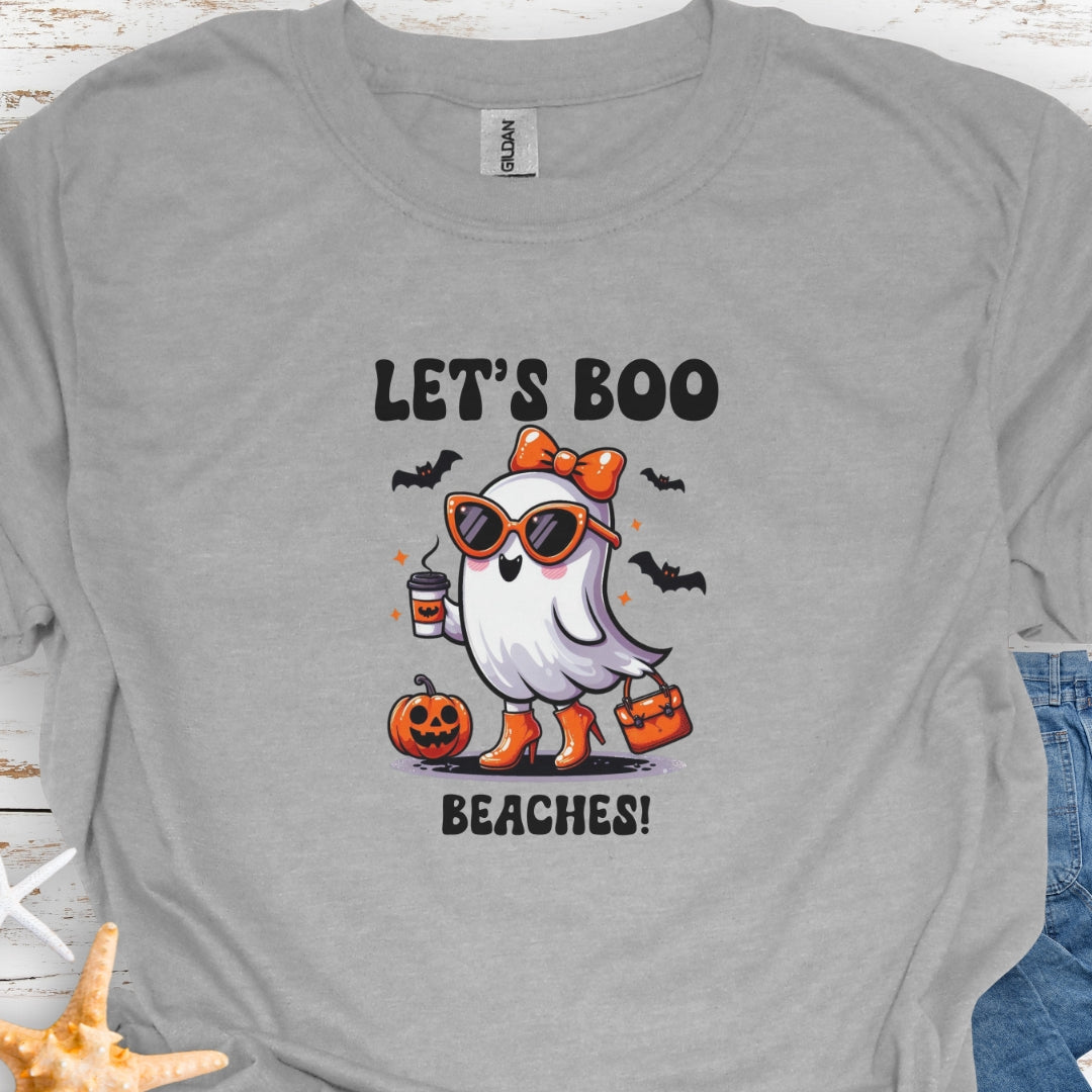 Gray  t-shirt with a girl ghost wearing sunglasses, high heels and an orange bow in hair holding a purse and coffee with bats flying around with text Let's Boo Beaches' 