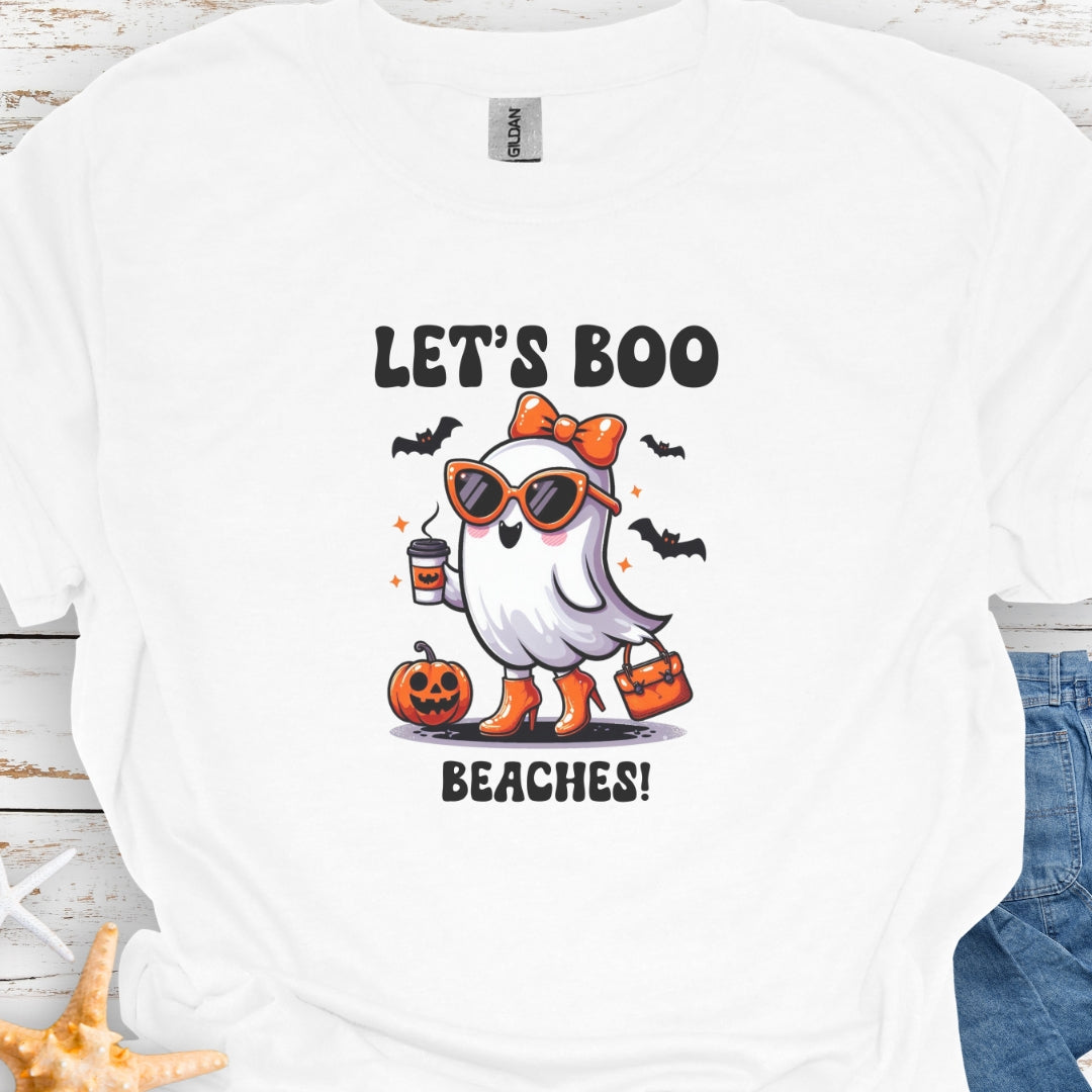 White  t-shirt with a girl ghost wearing sunglasses, high heels and an orange bow in hair holding a purse and coffee with bats flying around with text Let's Boo Beaches' 