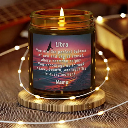 Elegant LIbra Zodiac hand-poured coconut apricot wax scented candle in a 9 oz amber glass jar, featuring a picture of the ocean at sunset with a bird flying and an inspirational quote personalized. A beach-inspired astrology gift, perfect for relaxation and decor.