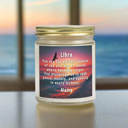 Elegant LIbra Zodiac hand-poured coconut apricot wax scented candle in a 9 oz amber glass jar with gold lid, featuring a scene of the ocean at sunset with bird flying in the sky with an inspirational quote personalized. A beach-inspired astrology gift, perfect for relaxation and decor.