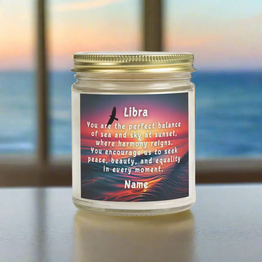 Elegant LIbra Zodiac hand-poured coconut apricot wax scented candle in a 9 oz amber glass jar with gold lid, featuring a scene of the ocean at sunset with bird flying in the sky with an inspirational quote personalized. A beach-inspired astrology gift, perfect for relaxation and decor.