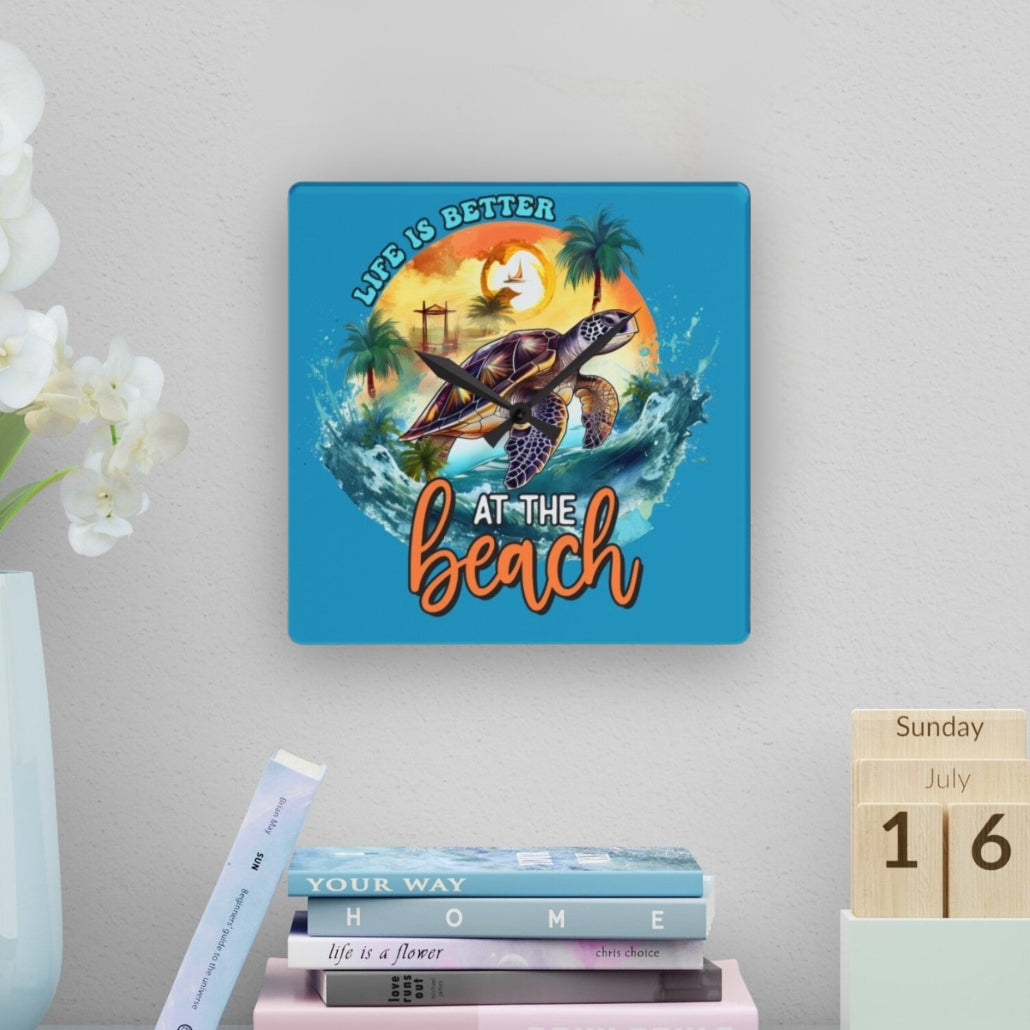 Square clock with Sea turtle swimming with sunset behind and text Life is better at the beach