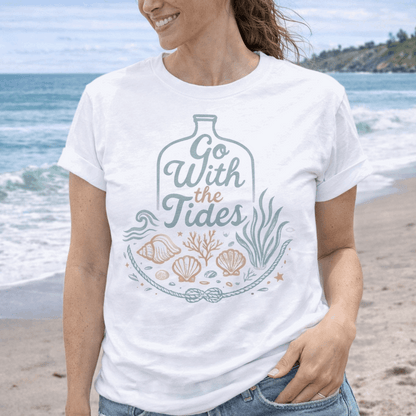 Woman wearing white Go With the Tides t-shirt with ocean bottle design, seashells, and coral artwork.