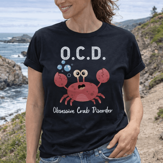 Woman wearing a black t-shirt with a cartoon crab and text OCD Obsessive Crab Disorder.