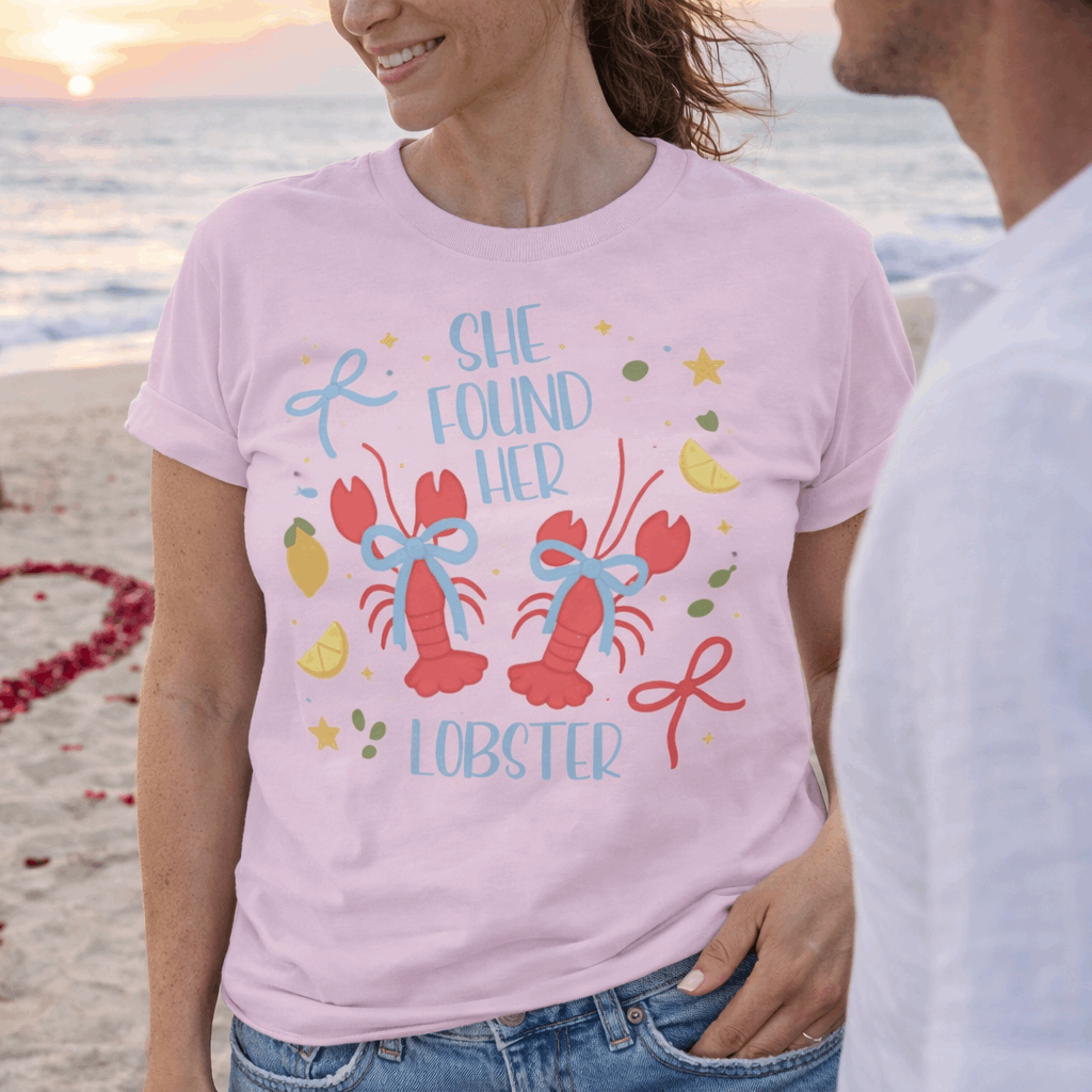 Woman wearing a t-shirt with 'She Found Her Lobster' graphic design.