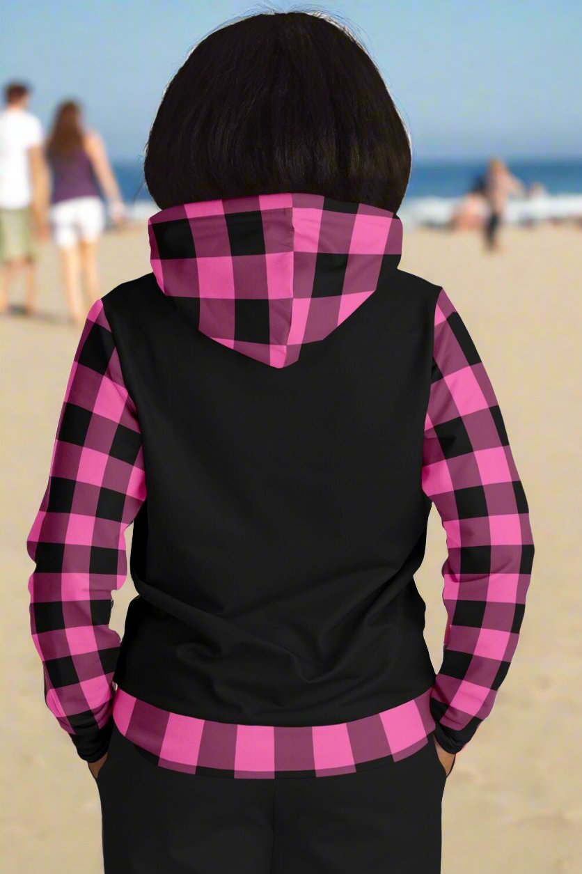 Back of black hoodie with hot pink and black gingham waist, sleeves, and hood.