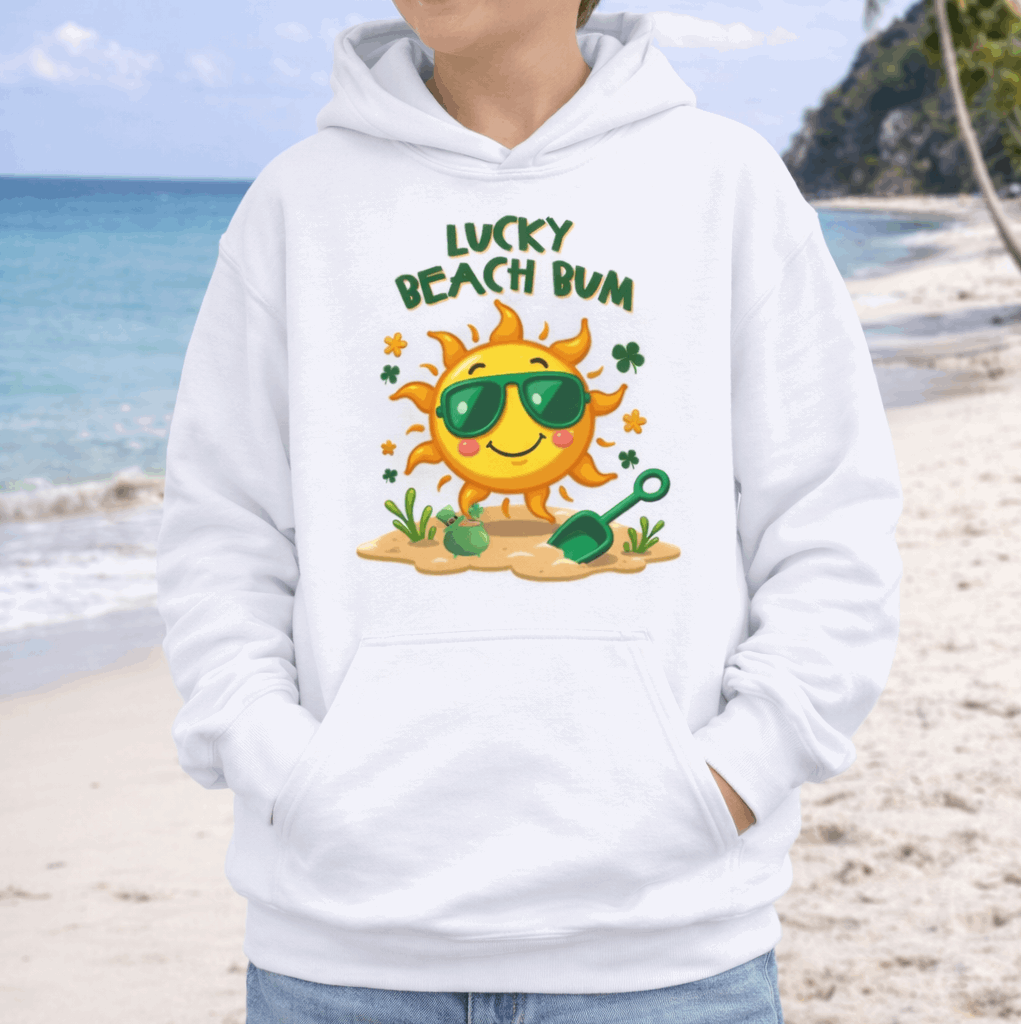 Child wearing a white hoodie with a sun graphic and 'Lucky Beach Bum' text with shamrocks and bot of gold.