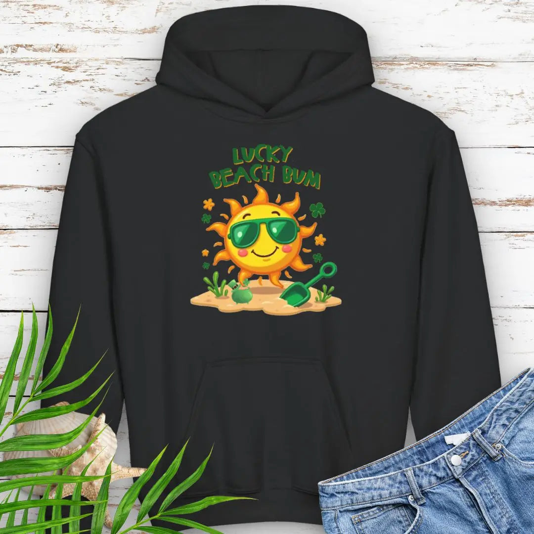 Lucky Beach Bum Child's Black Hoodie with a smiling sun wearing green sunglasses on the beach with beach toys.