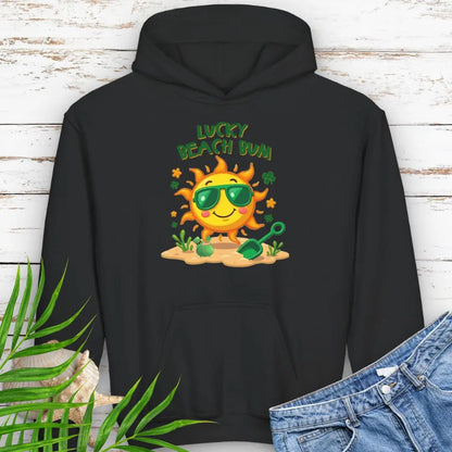 Lucky Beach Bum Child's Black Hoodie with a smiling sun wearing green sunglasses on the beach with beach toys.