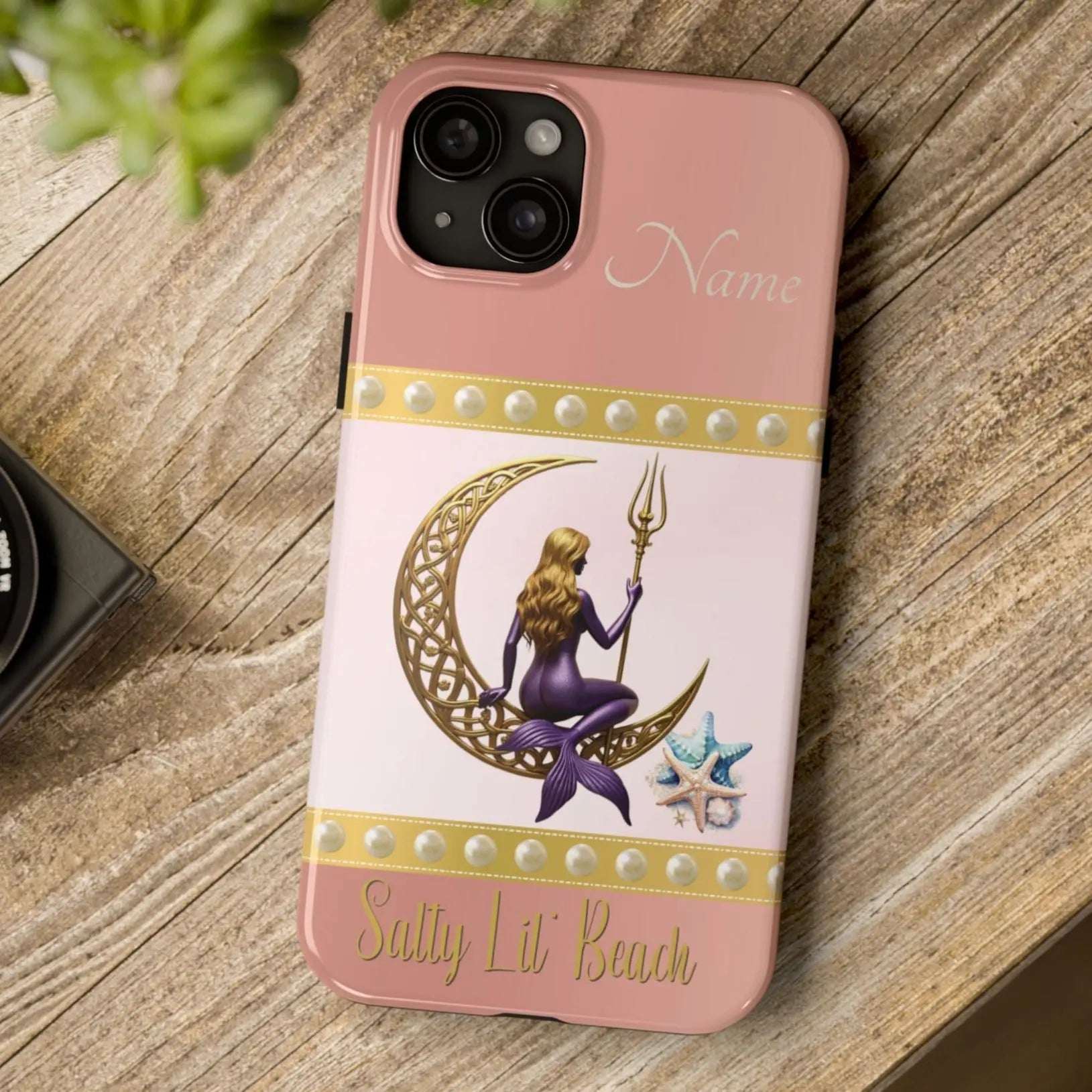 Pink and White 15 Plus iPhone Case with mermaid sitting on a celtic crescent moon holding a trident that says Salty Lil' Beach. Personalized with name.