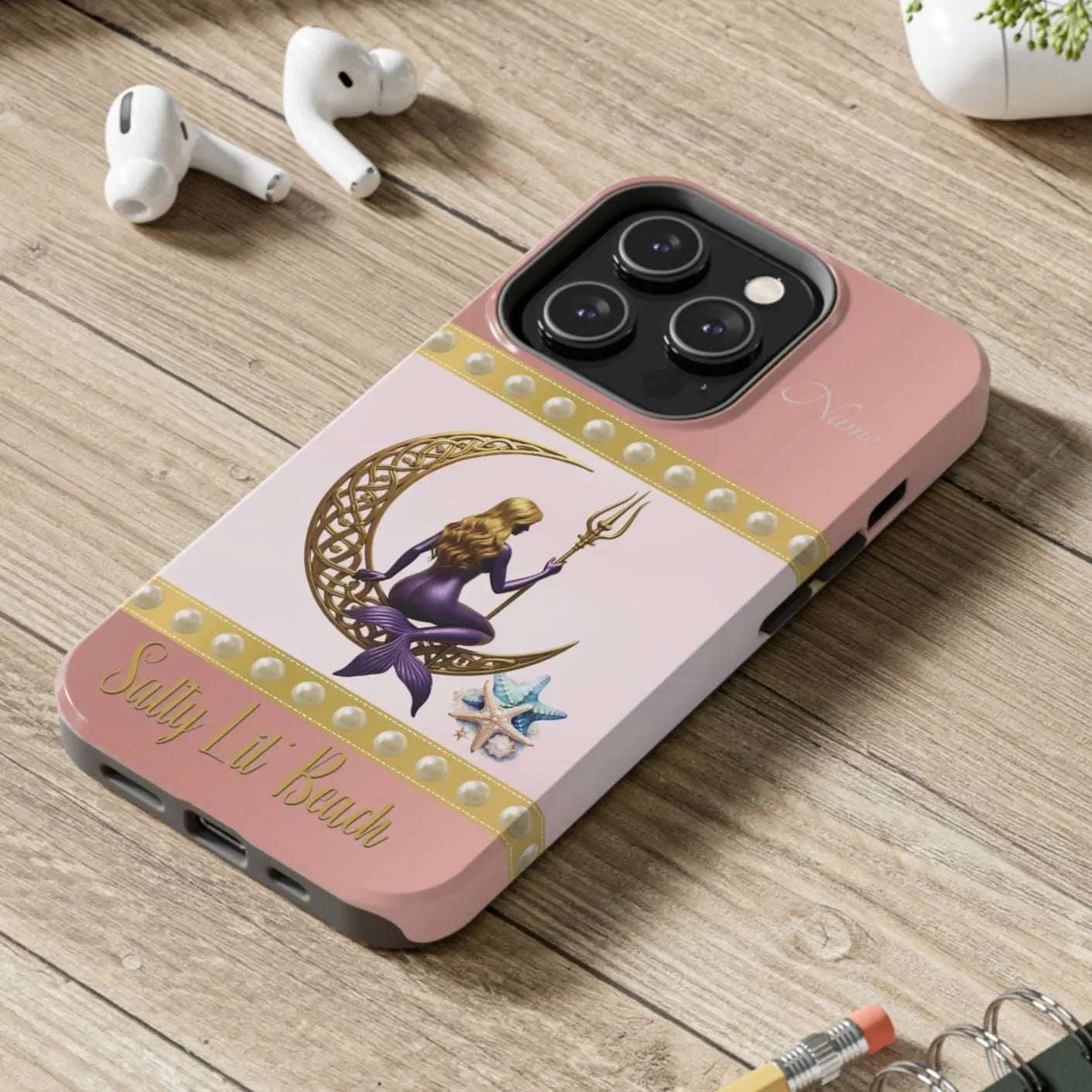 Pink and White 14 Pro iPhone Case with mermaid sitting on a celtic crescent moon holding a trident that says Salty Lil' Beach. Personalized with name.