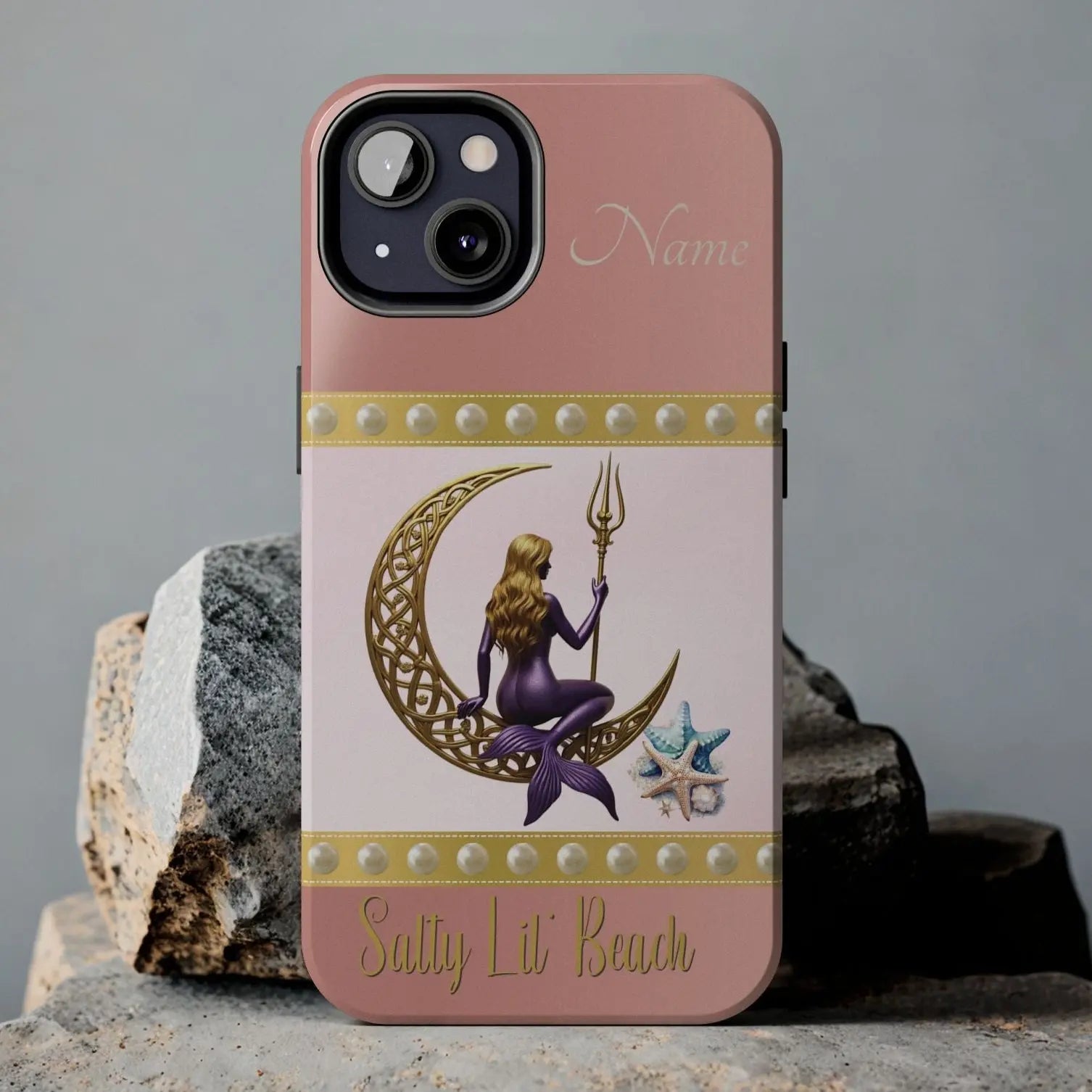 Pink and White 13 Pro Max iPhone Case with mermaid sitting on a celtic crescent moon holding a trident that says Salty Lil' Beach. Personalized with name.