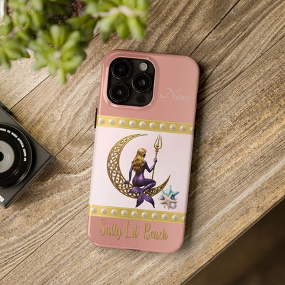Pink and White 15 Pro Max iPhone Case with mermaid sitting on a celtic crescent moon holding a trident that says Salty Lil' Beach. Personalized with name.
