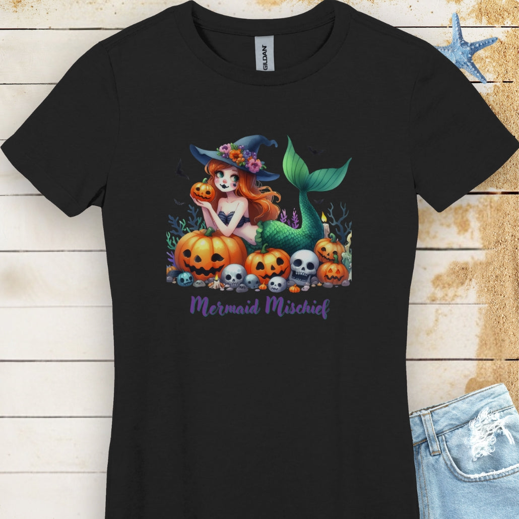 Black Women's T-shirt with mermaid in witches hat laying in pumpkin patch with text Mermaid Mischief.