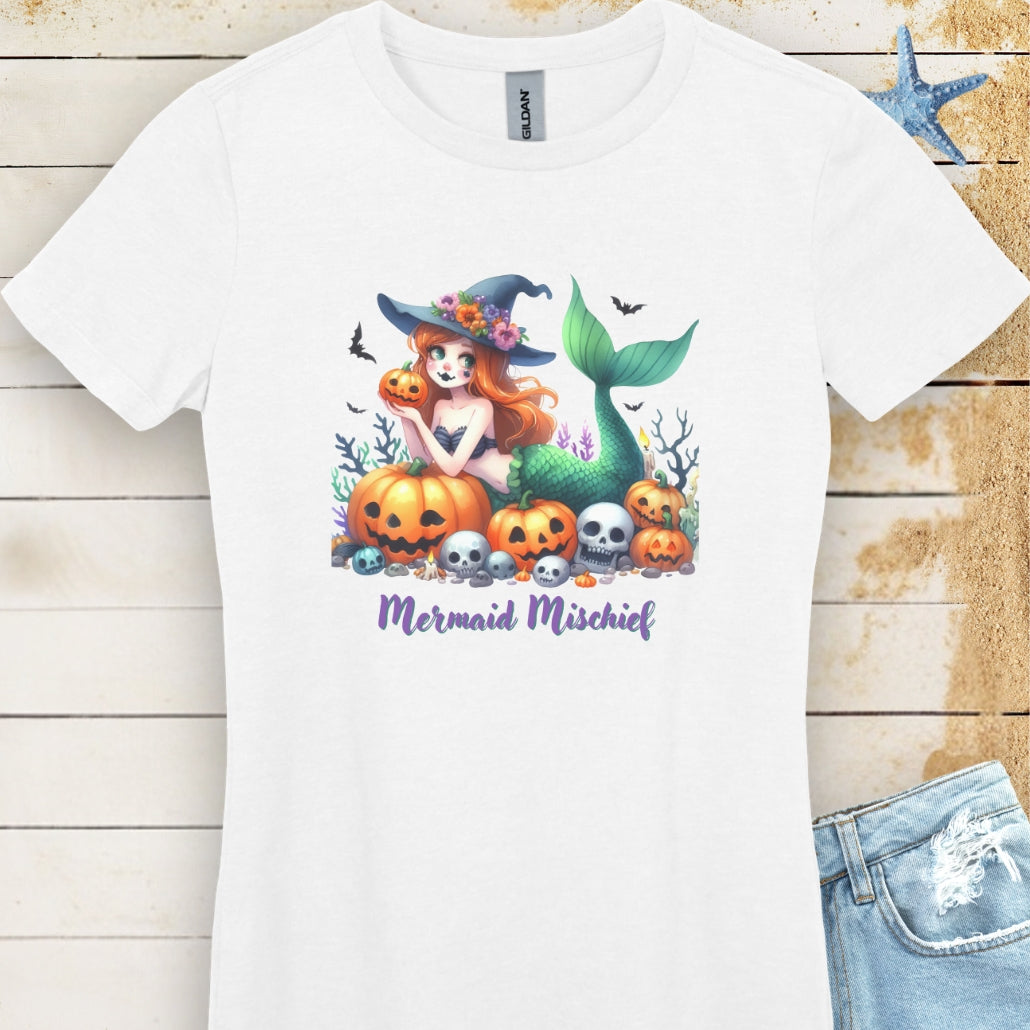 White Women's T-shirt with mermaid in witches hat laying in pumpkin patch with text Mermaid Mischief.