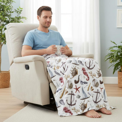 Man sitting in a recliner with a nautical blanket, holding a mug in a cozy living room.