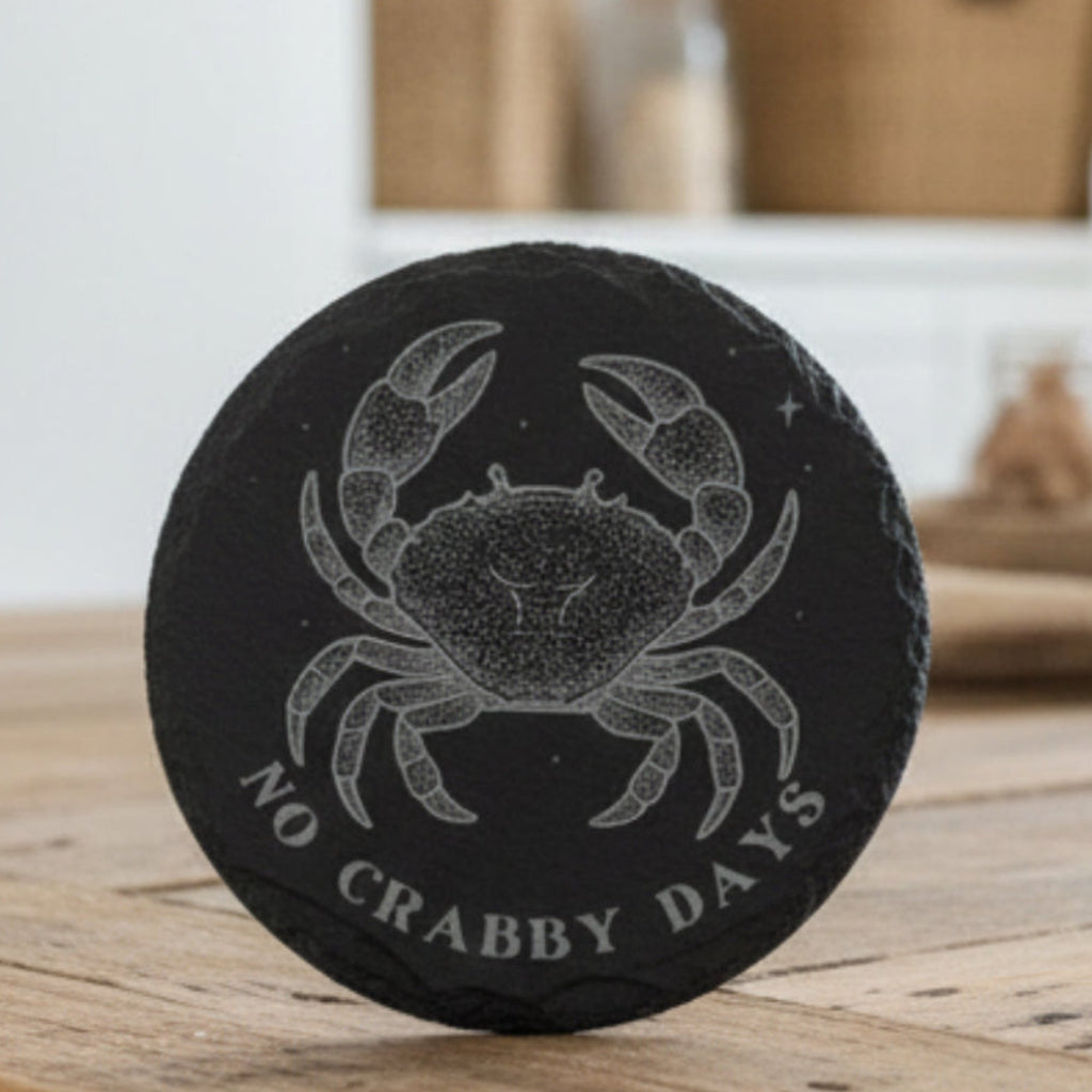 Black coaster with a crab design and 'No Crabby Days' text.