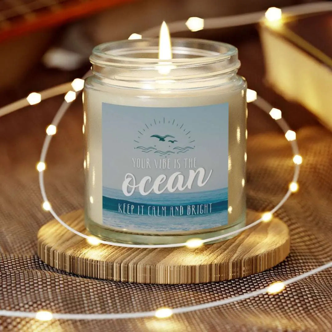 Clear 4 oz Jar scented candle featuring label with an ocean view with the inspirational phrase 'Your Vibe is the Ocean Keep it Calm and Bright,' making it the perfect addition to any nautical or coastal-themed home decor.