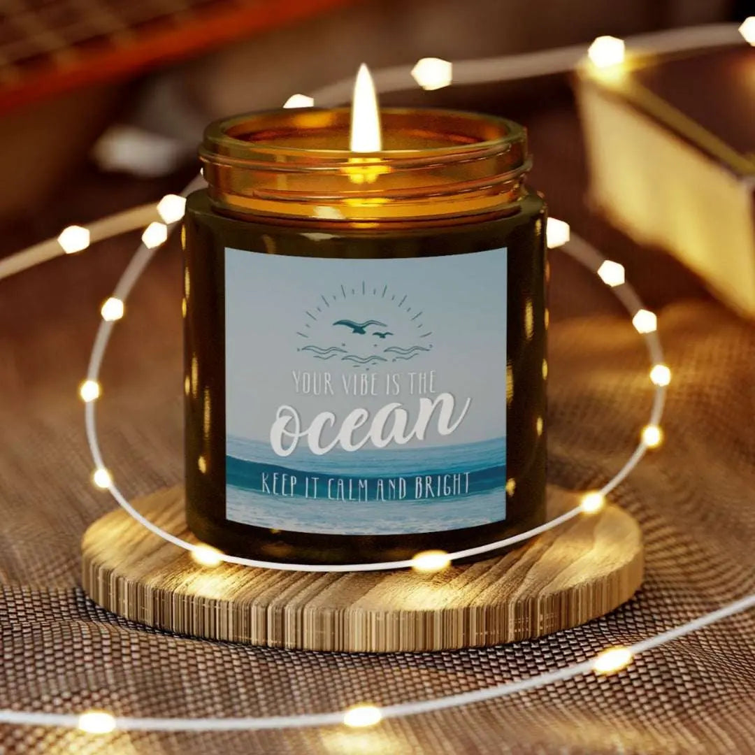 Amber 4 oz Jar scented candle featuring label with an ocean view with the inspirational phrase 'Your Vibe is the Ocean Keep it Calm and Bright,' making it the perfect addition to any nautical or coastal-themed home decor.