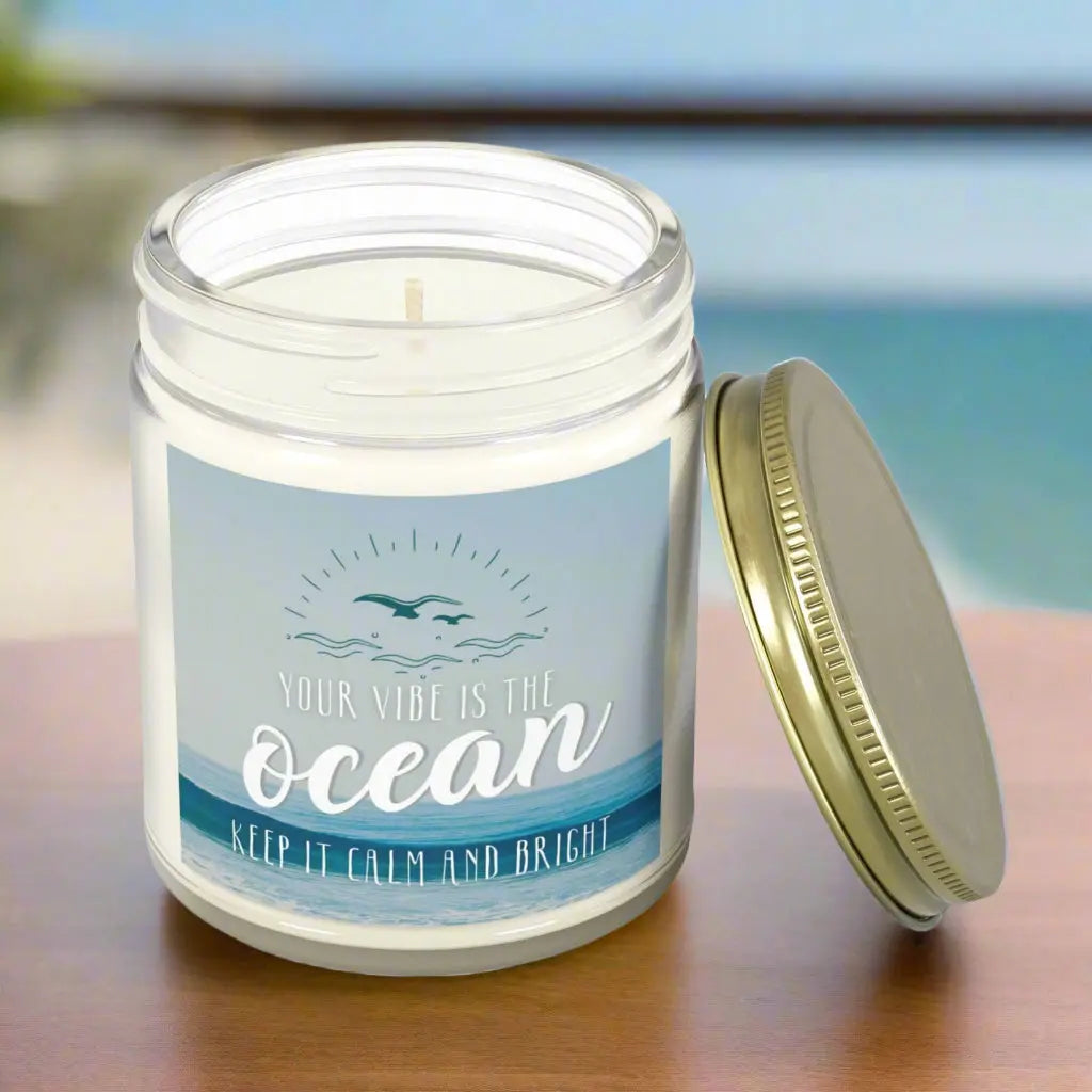 Clear 4 oz Jar scented candle featuring label with an ocean view with the inspirational phrase 'Your Vibe is the Ocean Keep it Calm and Bright,' making it the perfect addition to any nautical or coastal-themed home decor.