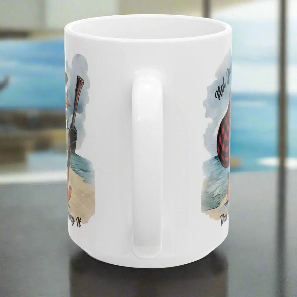 Side view of White 15 oz coffee mug featuring a fun beach design of a penguin running away on the sand with the text 'Not Just a Dreamer, This Bird’s Really Doing It.' A playful and unique gift for beach lovers and dreamers.