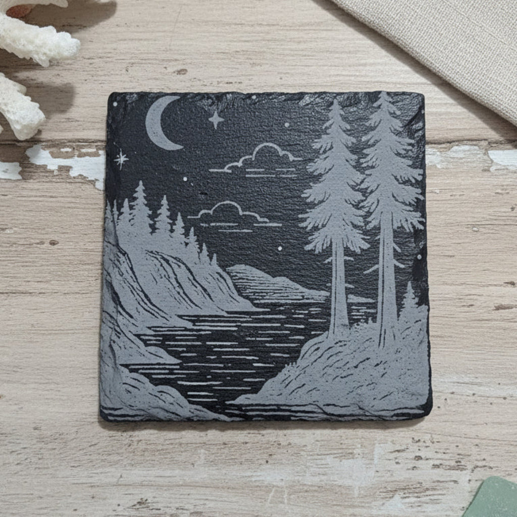 Wooden coaster with a nature design of trees and a river.