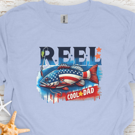 Baby Blue T-shirt with red white and blue fish with text Reel Cool Dad.