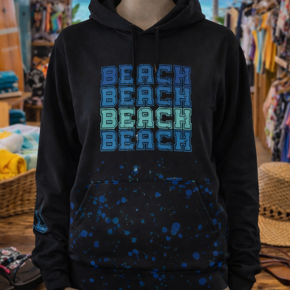 Black hoodie with 'BEACH BEACH BEACH' text in blue on a mannequin in a store.