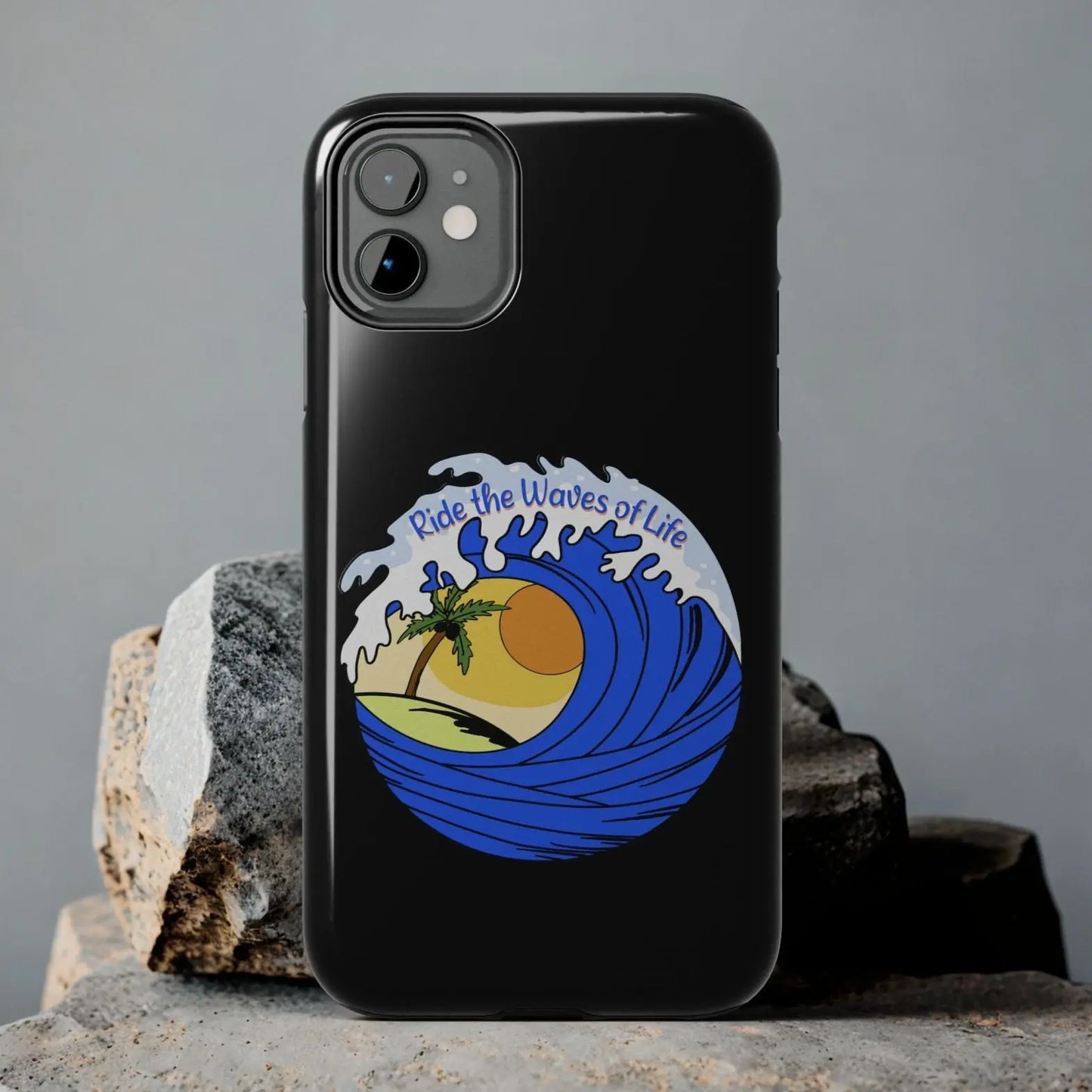 Black iPhone 11 Case with wave with sun and palm tree in the middle that says Ride the Waves of Life.