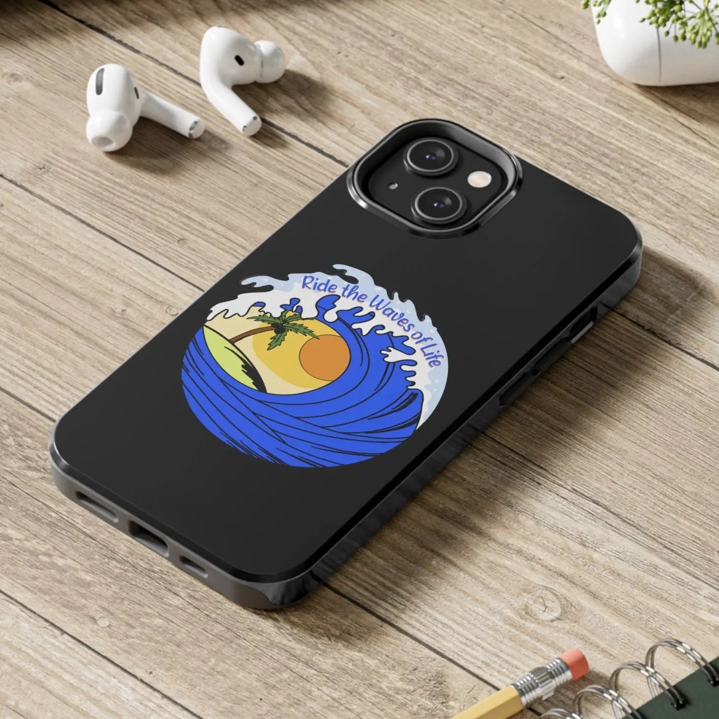Black iPhone 14 Case with wave with sun and palm tree in the middle that says Ride the Waves of Life.