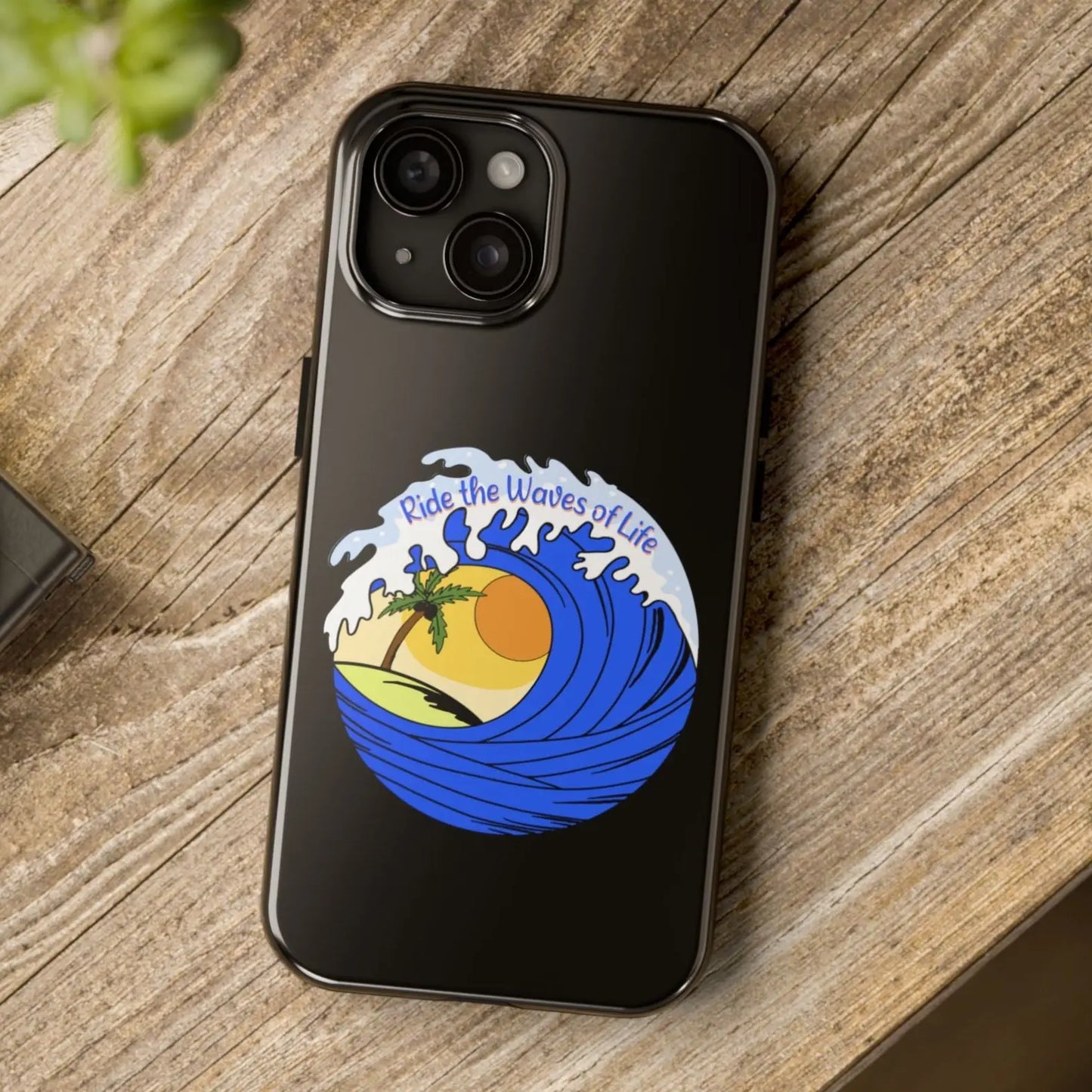 Black iPhone 15 Case with wave with sun and palm tree in the middle that says Ride the Waves of Life.